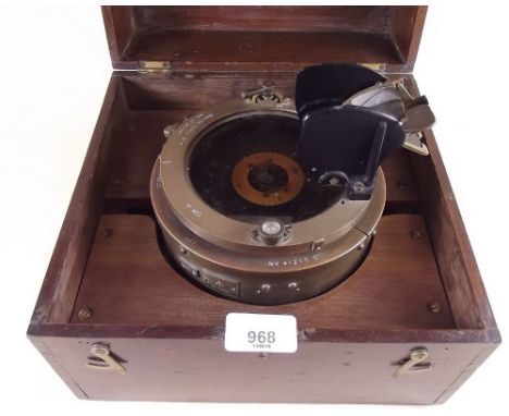 A ships compass in mahogany case