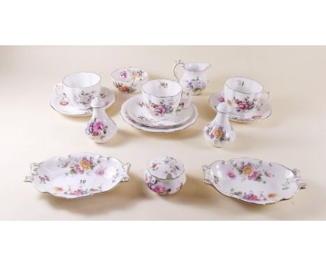 A Royal Crown Derby 'Derby Posies' group of tea ware comprising: three cups and saucers, jug and sugar, salt and pepper, must