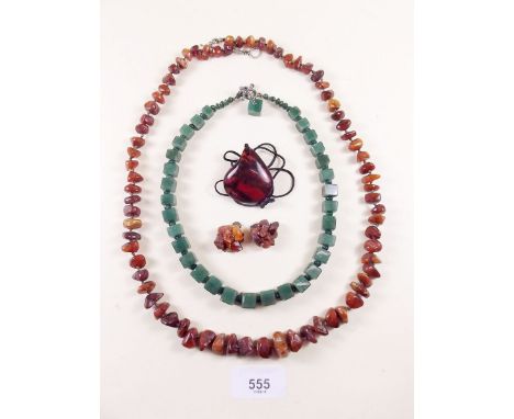 A chip amber necklace, another amber necklace and a jade necklace