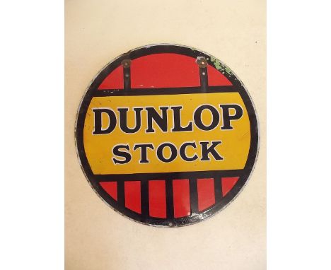An antique 'Dunlop Stock' circular enamel advertising sign - double sided - 61cm dia