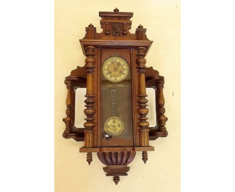 A Victorian Vienna style wall clock with Art Nouveau floral embossed copper dial and pendulum and mirrored panels to sides