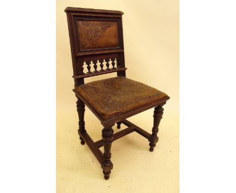 A Victorian Puritan style chair with embossed leather seat and bobbin turned supports
