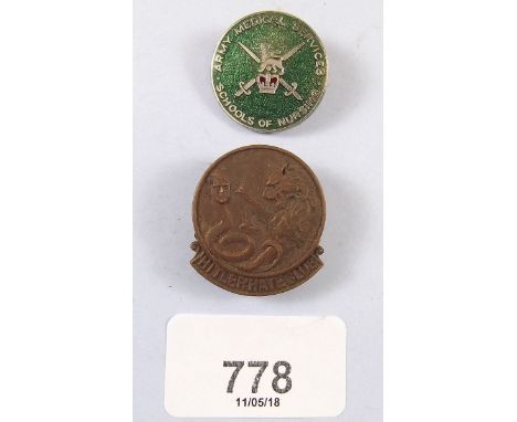 A 'Hate Hitler' club badge and Army Nursing badge