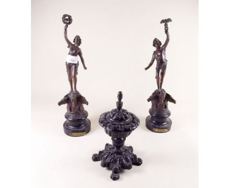 A pair of Spelter figures of man and woman and a Victorian cast iron inkwell