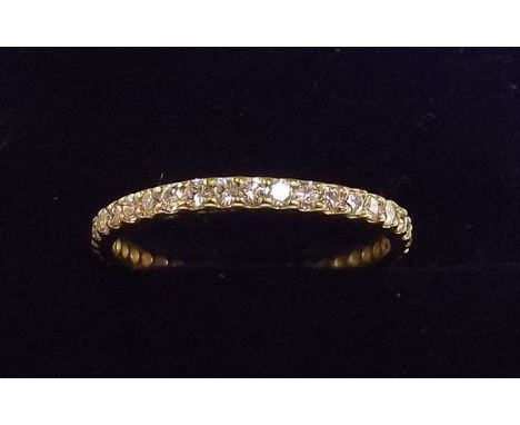 An 18 carat gold diamond set eternity ring, size K