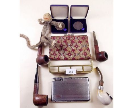 A box of pipes, lighter, cigarette case etc