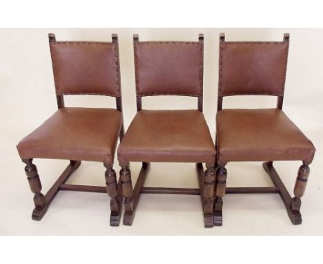 A set of six leather upholstered Puritan style dining chairs on bobbin turned supports
