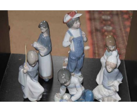 COLLECTION OF FIVE LLADRO FIGURES AND A NAO FIGURE