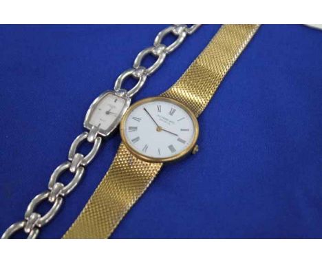 GENTLEMAN'S RAYMOND WEIL GOLD PLATED WRISTWATCH
the white dial with Roman numerals; together with a lady's silver 'Rotary' wr