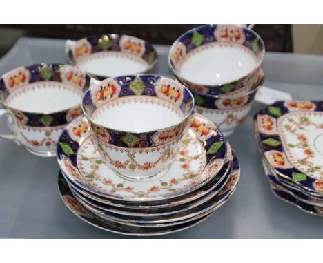 LATE VICTORIAN TEA SET
stamped 'St Michael China', with brown transfer floral swag design with hand-painted blue borders, six