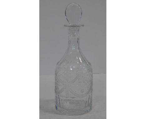 A William Yeoward engraved crystal decanter with fern, floral and ribbon swag design. A faceted tear drop stopper and honeyco