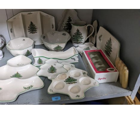 A collection of Spode Christmas tree table wares to include a boxed set of four napkin rings, dishes, bowls and a water jugLo