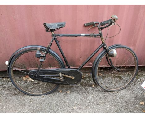 A gent's Raleigh Sports model, two-speed, with 23" black painted frame, Lycett saddle, 26" wheels, circa 1930/40 Location:If 