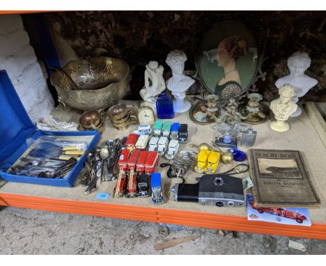 A mixed lot to include a gilt metal two branch candelabra, mixed cutlery, various model cars, silver plated punch bowl, ladle