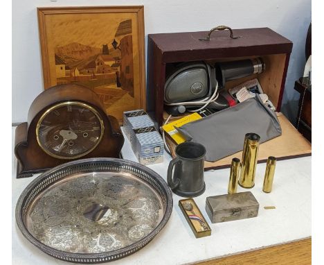 Mixed items to include a clock, a projector, gun shell cases, a tankard, a tray and other itemsLocation:If there is no condit