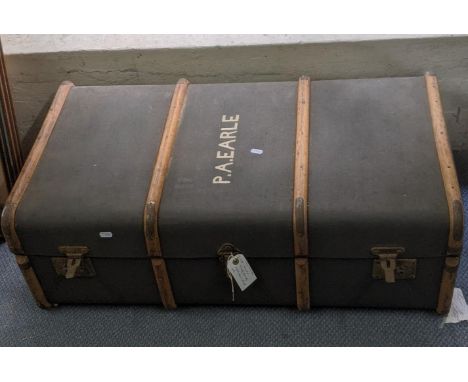 An early 20th century Canvas bound trunk with bent wood supports inscribed to the lid P.A. Earle 90cmW x 51cm Deep 32cm HLoca