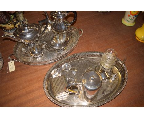 A three-piece plated tea service; a coffee pot; water jug; two oval plated salvers with pierced galleries; and sundry plated 