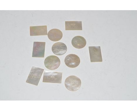 A Chinese carved mother-of-pearl gaming tokens decorated with flowers.