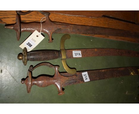 Two polished Middle Eastern swords with curving blades, the metal handles with guards; and a similar sword with brass guard, 