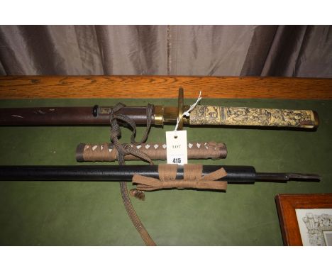 A reproduction Japanese sword with imitation carved ivory handle, leather and metal scabbard; and another reproduction Japane