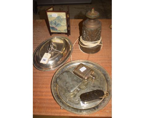 An EPNS double entree dish and cover; an embossed brass table lamp; two hip flask; a composition box containing two whistles;