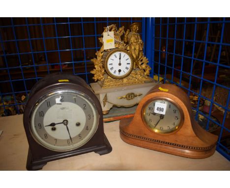 An early 20th Century mantel clock in arched bakelite case; another mantel clock in solid wooden arched case; together with a