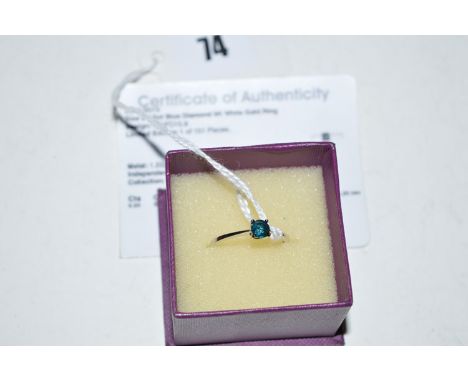 A blue diamond ring, the brilliant cut diamond weighing approximately 0.50 carats, limited edition, in 9ct. white gold, ring 