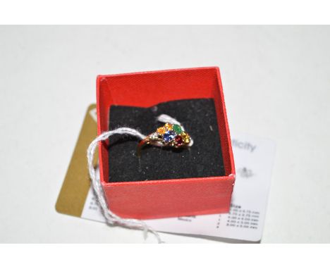 A gemstone set ring of opal, spinel, tanzanite, emerald, etc., mounted in 9ct. yellow gold, with certificate, ring size S.