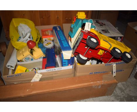 A wooden toy trike; a Jet Hopper radio controlled car, by Taiyo; two Tonka tip-up trucks; a Fisher Price lift-and-load depot 