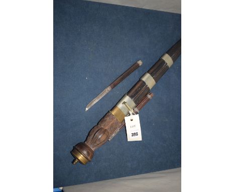 A reproduction Asian style dagger in leather and white metal scabbard, the dagger with single pointed fullered blade, the car