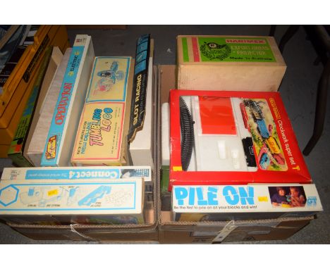 Two boxes of toy games, to include: Mr. Men marble games; Operation; Connect Four; Pylon; a Bigtrak; and a Hornby R.533 Clock