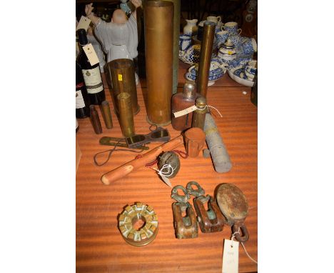 A collection of eight, mostly brass, military shell cases, various sizes; a pair of aviators tinted glasses; a flask and four