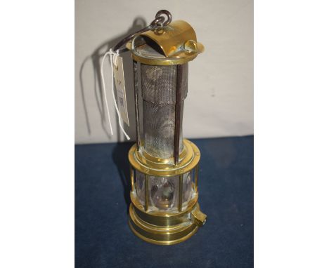 John Mills, Newcastle Upon Tyne: a 19th Century miner's lamp with bridge top, the gauze enclosed by three pillars above glass
