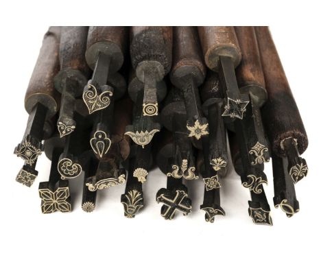 * Decorative finishing tools. 25 brass decorative finishing tools, including centre tools, majority of tools unnamed with mak