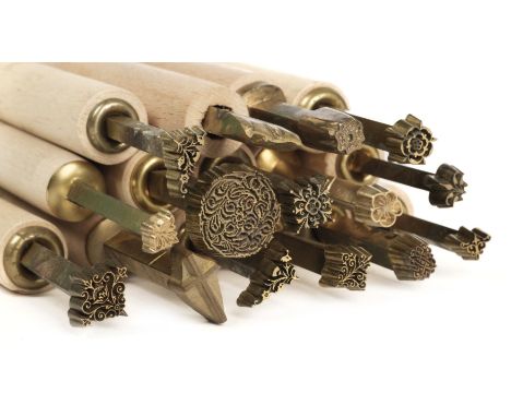 * Decorative finishing tools. 21 brass decorative finishing tools, including centre &amp; corner tools etc., majority late 20