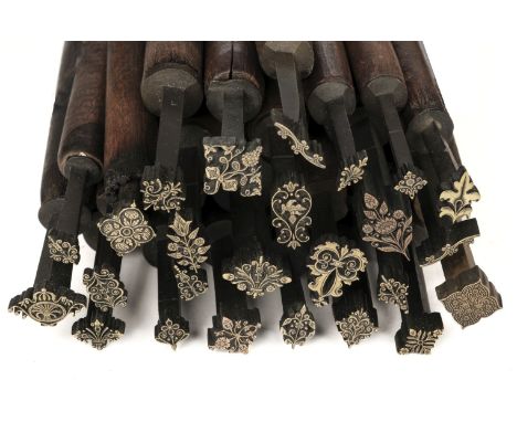 * Decorative finishing tools. 25 brass decorative finishing tools, comprising mostly centre tools, makers include Hicks, Timb