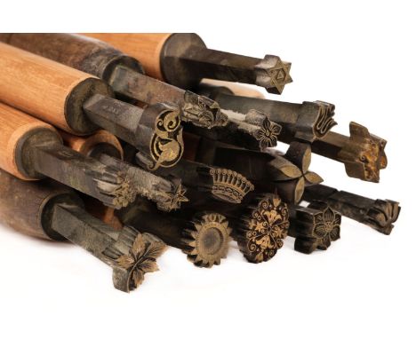* Decorative finishing tools. 45 brass decorative finishing tools, comprising centre and small motif tools, of later 20th cen