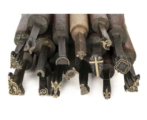 * Decorative finishing tools. 40 brass decorative finishing tools, comprising centre, corner and miscellaneous tools, makers 