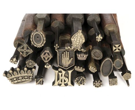 * Decorative finishing tools. 25 brass decorative finishing tools, including centre tools, motifs include crowns, coronets, B