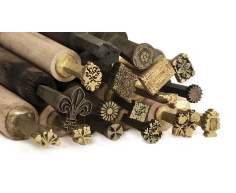 * Finishing tools. A collection of approximately 80 brass decorative finishing tools, comprising corner &amp; centre tools, m