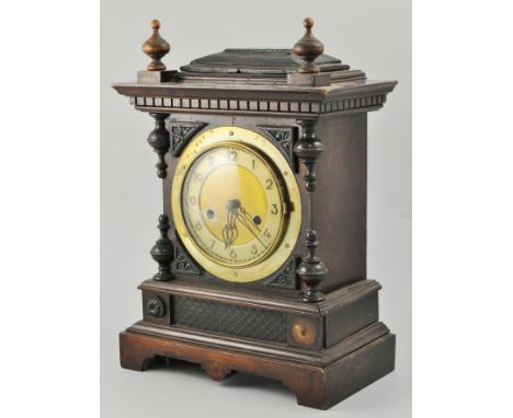 German oak-cased mantel clock, brass dial, height 37cms.