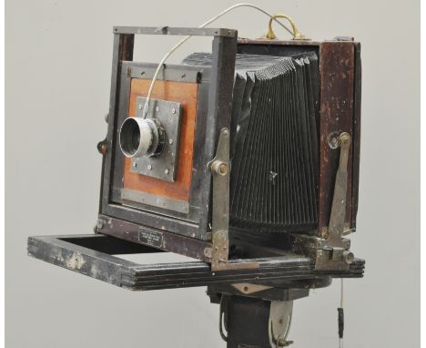Vintage plate camera, adapted on an adjustable tripod, height as assembled 117cms.