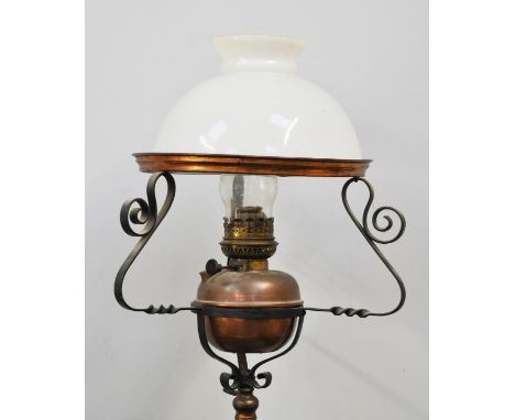 Wrought iron adjustable standard lamp, triform base with a copper reservoir, complete with opaque mushroom shade, 158cms over