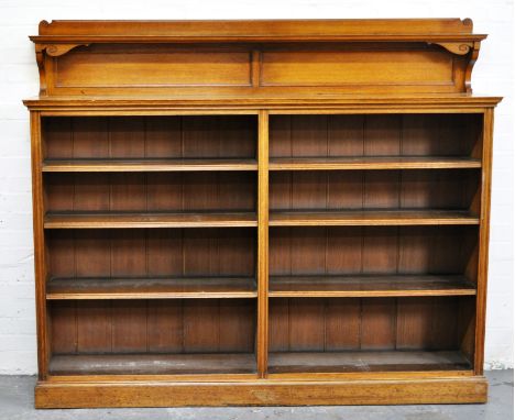 Edwardian oak open bookcase, with shelf over, two banks of three adjustable shelves, plinth base, length 183cms, height 153cm
