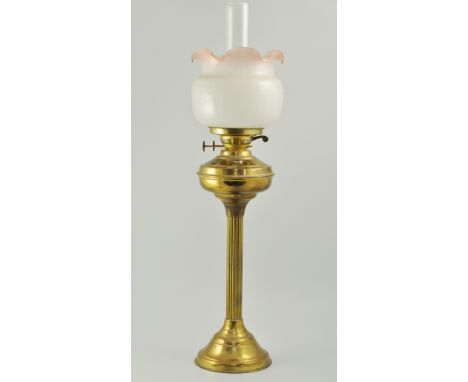 Victorian brass oil lamp, opaque glass shade, with cranberry tinted wavy rim, clear glass chimney, height 69cms, 