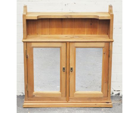 Pine bathroom cabinet, two mirrored doors, shelf under, width 66cms.