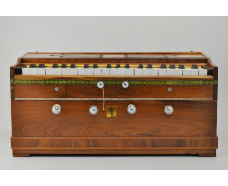 Indian harmonium, in original box with booklet.