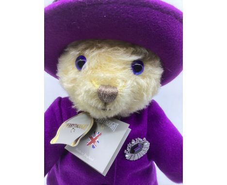 Merrythought Queen Elizabeth 11 teddy bear dressed in an Angela Homes replica costume and jewellery &nbsp;and hat in deep pur