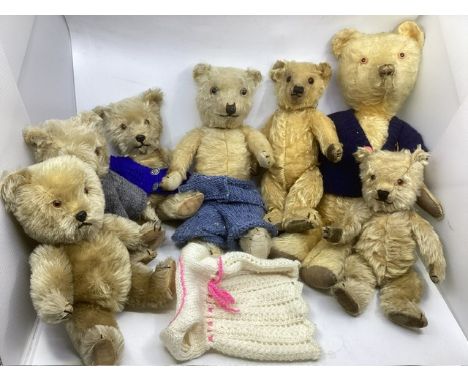 Antique and vintage mainly Chiltern teddy bears across several decades, many with carded flat foot over velvet and others-the