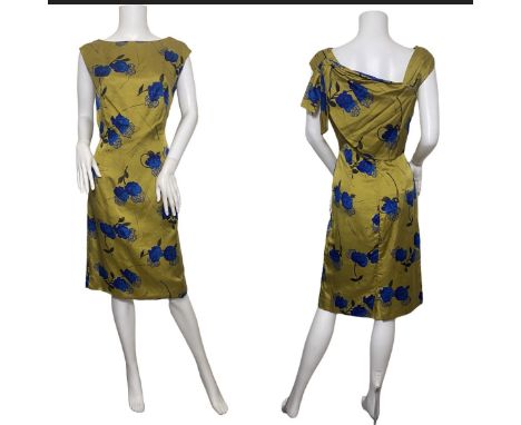 A late 50s/ early 1960s dress suit by Mandell Couture consisting of a tailored dress with shelf bust and a boxy jacket in blu